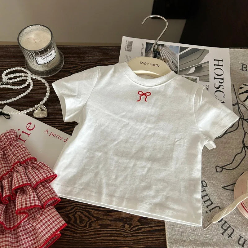 Korean children's clothing 2025 new summer girls' bow white T-shirt children's checkered cake skirt pants two-piece set
